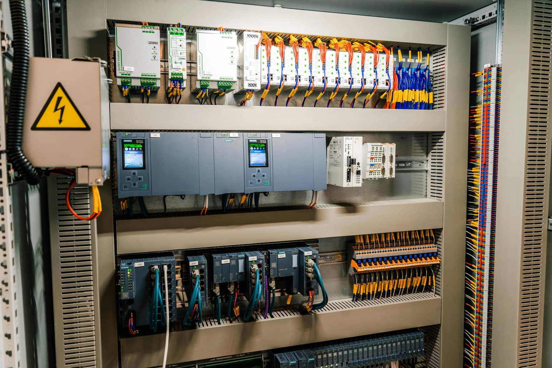 Industrial control panel with PLCs, terminal blocks and wiring